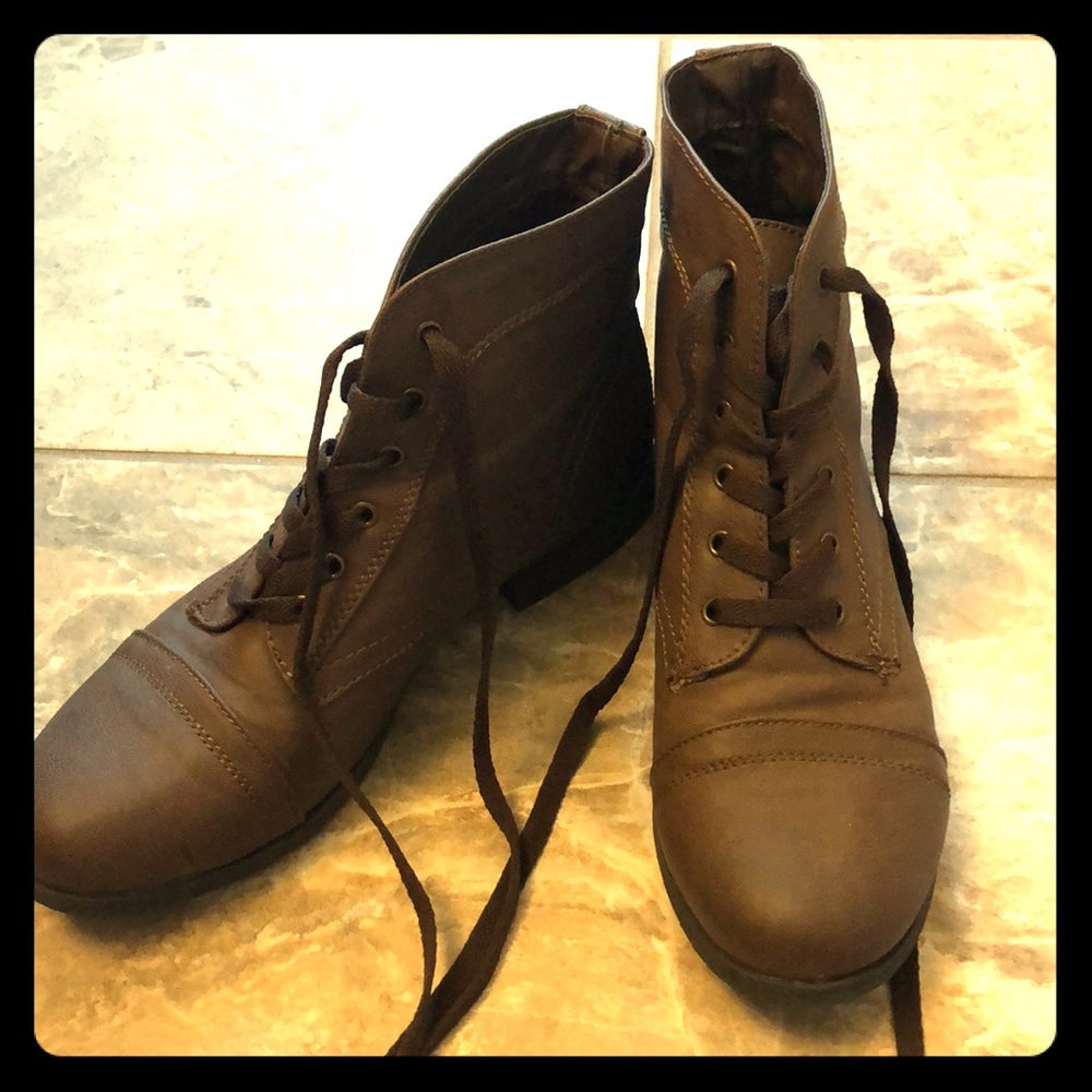 Brown lace-up boots.